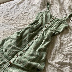 Green dress with brown buttons